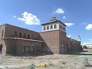 The historic El Cid Castle was a bowling alley which resembled a Moorish Castle. It was built by Dr. Kenneth Hall, a physician who served the community of Sunnyslope in Phoenix. Construction on the structure began in 1963 and was completed in 1980. It was located at the Northwest corner of 19th Ave and West Cholla Drive which is on the opposite side of Sunnyslope's western boundary.[29]