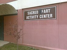 An example of grafitti where a sign has been edited to spell the word "fart". Grafitti and farting are widely considered to be rude, but this rudeness is often seen as having comic potential.