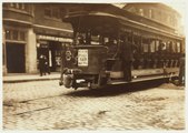 Is this NYC or Boston? Because some signs on this trolley seem to say IRT and an advertisement for Food Fair supermarkets, but there's a possibility the one on the left says "South Station Subway."