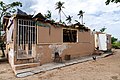 A damaged house exterior in Loíza