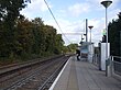 A singular tram track with a platform on the right.