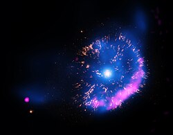 A blue and purple nova in space, with a luminous star in the centre