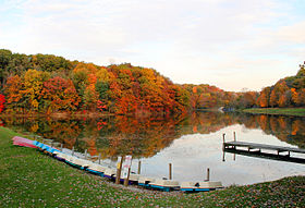 Pond with dock and paddlecraft