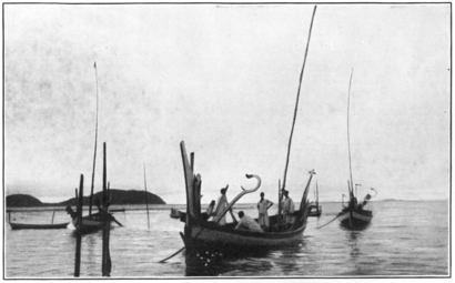 Two perahu payang with curved masts.
