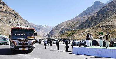 Prime Minister Narendra Modi flags off a bus from Manali after inaugurating the Atal Tunnel.