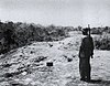 A U.S. Marine looks at some fighting positions on Edson's Ridge