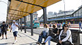 Passengers waiting for buses outside the station