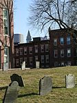 Copp's Hill Burying Ground in the North End with the Custom House Tower and One International Place glimpsed in the distance