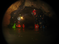 Cave divers with head mounted lights.