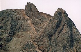 The 'Inaccessible Pinnacle', with climbers on the summit of Sgùrr Dearg