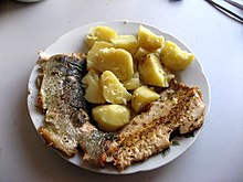 Photo of fried fish filet on a plate