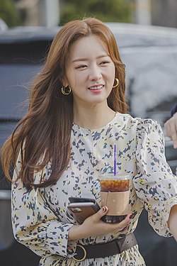 Yoon in white patterned dress in January 2020