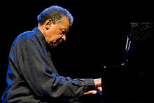 Abdullah Ibrahim seated at a Piano