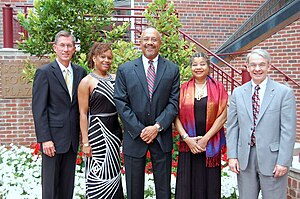 A photo of Williams when he was installed at the Milton Morris Endowed Chair at the University of Denver. Standing to his left is Greg Kvistad and his daughter Kimberly Hardy. Standing to his right is Rose Smith and Robert Coombe.