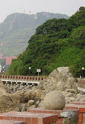 A mountain looms over a school building