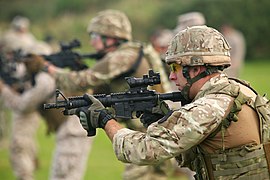 Members of 43 Commando Fleet Protection Group Royal Marines train using L119A1 carbines fitted with a CQB upper receiver.