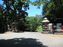 Two short stone columns signify the park's entrance.