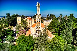 The statue of Madonna and Child above the Church of Notre Dame