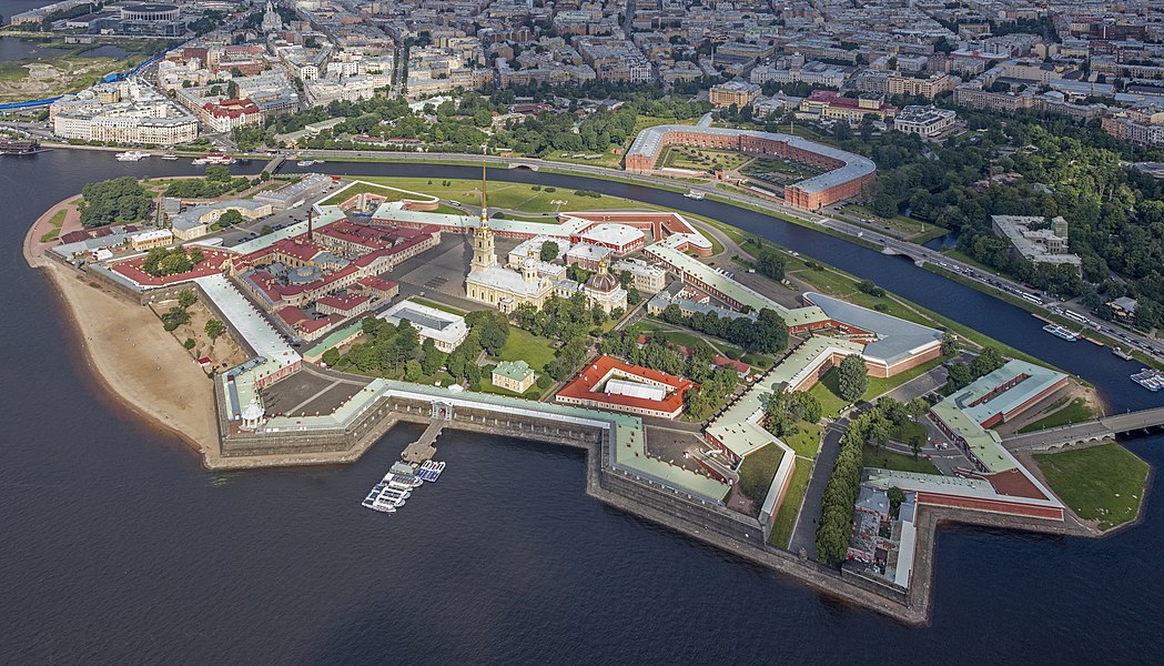 Russia: Aerial view of Peter and Paul Fortress (Russian: Петропа́вловская кре́пость, Petropavlovskaya Krepost) on Zayachy Island, Saint Petersburg. It was founded by Peter the Great in 1703 and built to Domenico Trezzini's designs from 1706 to 1740. In the early 20th century it was still used as a prison by the tsarist government. Today it has been adapted as the central and most important part of the State Museum of Saint Petersburg History. The museum has gradually become the sole owner of the fortress building, except for the structure occupied by the Saint Petersburg Mint.