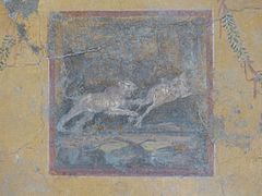 Closeup of panel painting with hunt scene