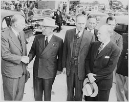 Secretary of Defense George C. Marshall greeting President Truman following Truman's return from the Wake Island Conference at Washington National Airport, 18 October 1950.