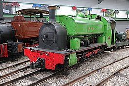 A small narrow-gauge green engine
