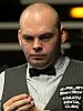 Stuart Bingham holds a snooker cue