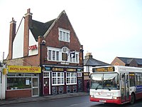 A pub in Surbiton, London advertising Skol
