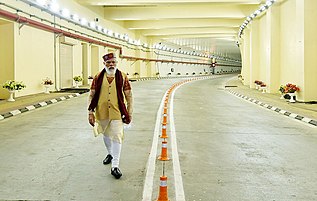 Prime Minister Narendra Modi is walking through the roads of the tunnel after its inauguration.