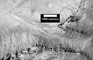 East Slope of Central Pit in Asimov Crater, as seen by HiRISE. Click on image to see more details of the many gullies.