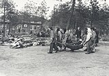17 April 1945, Bergen-Belsen inmates, whom carried dead bodies from the huts in the open air for the funeral.