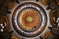 Image 29The dome of the Illinois State Capitol. Designed by architects Cochrane and Garnsey, the dome's interior features a plaster frieze painted to resemble bronze and illustrating scenes from Illinois history. Stained glass windows, including a stained glass replica of the State Seal, appear in the oculus. Ground was first broken for the new capitol on March 11, 1869, and it was completed twenty years later. Photo credit: Daniel Schwen (from Portal:Illinois/Selected picture)