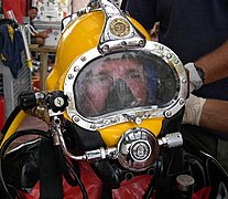 Diver wearing lightweight demand helmet