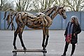 Sculptor Heather Jansch standing next to the latest cast of her work "The Young Arabian"