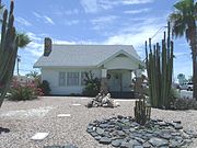 The House at 323 West Eighth St. was built in 1918 and is located at 323 W. 8th St. It was listed in the National Register of Historic Places in 2002, reference #02000744.