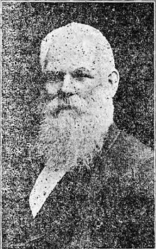 Black-and-white photographic portrait of a white-haired, heavily-bearded gentleman circa 1892
