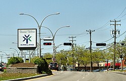 "Welcome to Kirkland" sign viewed from St. Charles Blvd (heading north)
