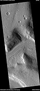 Wide view of flow moving down valley, as seen by HiRISE under HiWish program Location is Ismenius Lacus quadrangle.