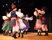 Dancers from the Polanie dance group in Ottawa wearing costumes from the Kraków region.