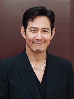 Lee smiling dressed in black shirt