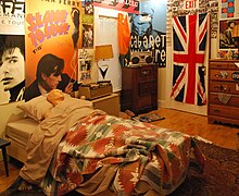 A replica of Ferris Bueller's bedroom, with band posters on the wall