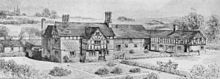 A black-and-white drawing showing a farm from a slightly elevated angle. The farmhouse is to the left and has a protruding bay with a timber-framed gabled upper storey; a farm building is at a right-angle on the right, and its upper storey is entirely timber-framed.