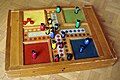 Image 17Parcheesi is an American adaptation of a Pachisi, originating in India. (from Game)