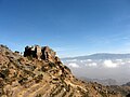 The mountain (background) as viewed from the terraced side of mountain at Al Mahwit Governorate