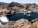 Water enters Hoover Dam's Arizona side channel drum-gate spillway (left) during the 1983 floods