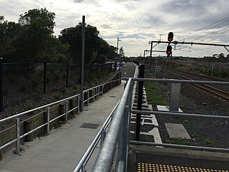 Footpath leading to a carpark. Photo faces east and is taken from platform 1.