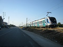 A train runs near the city of Mahdia.