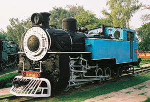 Black locomotive with a blue cab