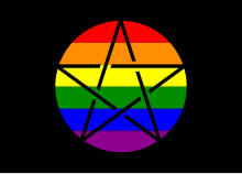 Rectangular flag with black background. A circumscribed pentagram (known as a pentacle) with black lines and a LGBTQ rainbow background sits in the center.