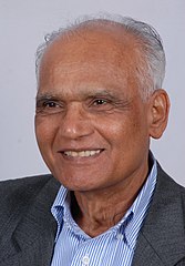 A photograph of a smiling old man.